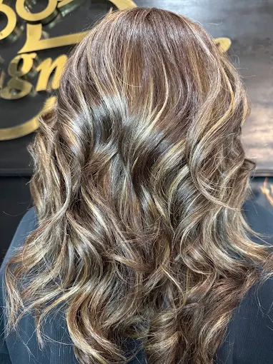 Highlighted hair with defined waves and shine